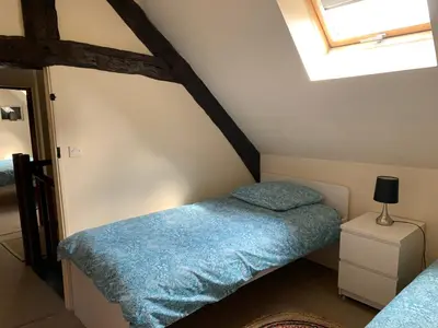 Un ou plusieurs lits dans un hébergement de l'établissement Le Bas Chesnay Gîte Domfront en Poiraie