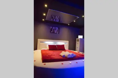 Un ou plusieurs lits dans un hébergement de l'établissement Gîte Love Dream - Le Gîte Romantique