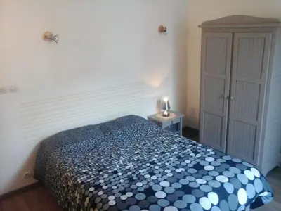 Un ou plusieurs lits dans un hébergement de l'établissement Maison charmante - Pontorson + Parking