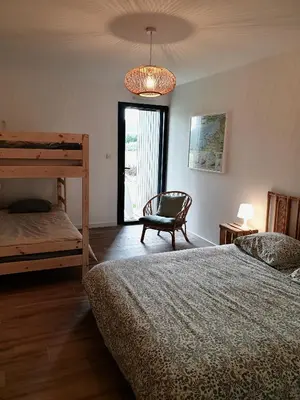 Un ou plusieurs lits dans un hébergement de l'établissement Maison Les Dunes Bourgales