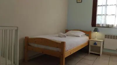 Un ou plusieurs lits dans un hébergement de l'établissement Gîtes Les Clairets - Normandie