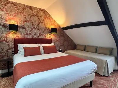 Un ou plusieurs lits dans un hébergement de l'établissement Churchill Hotel Bayeux Centre