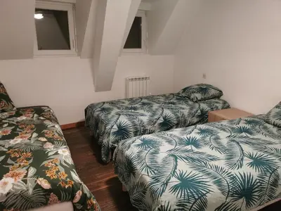 Un ou plusieurs lits dans un hébergement de l'établissement La petite maison de la Tante Marie