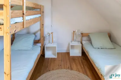 Un ou plusieurs lits dans un hébergement de l'établissement Villa Jules Grand Gîte