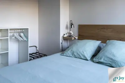 Un ou plusieurs lits dans un hébergement de l'établissement Villa Jules Grand Gîte