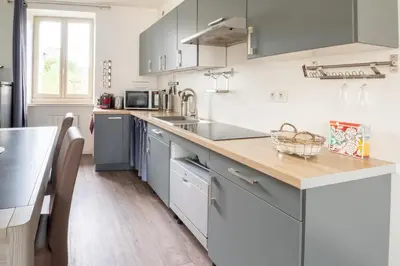 Cuisine ou kitchenette dans l'établissement Le P'tit Cancalais