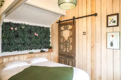 Un ou plusieurs lits dans un hébergement de l'établissement Chalet Nature & Spa