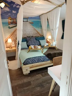 Un ou plusieurs lits dans un hébergement de l'établissement Le Maréchal Duplex - Appartement avec Jacuzzi - CAEN hyper Centre