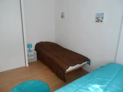 Un ou plusieurs lits dans un hébergement de l'établissement Cottage 3 pièces à Dives-sur-Mer, jardin privé, proche Port Guillaume, piscine, animaux acceptés - FR-1-487-301