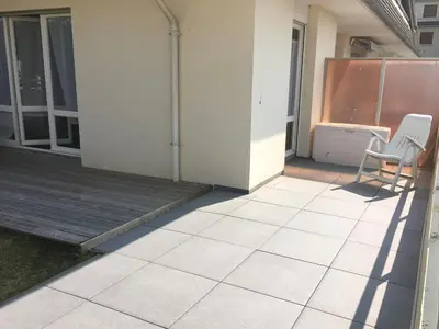 Coin salon dans l'établissement Appartement 2 pièces avec terrasse près de la plage - Merville-Franceville - FR-1-487-311