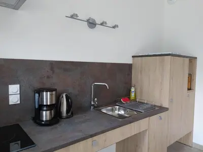 Cuisine ou kitchenette dans l'établissement Junior Suite Triple PMR Résidentielle avec cuisine au Manoir de Mathan à Crépon 5mn d'Arromanches et 10 mn de Bayeux
