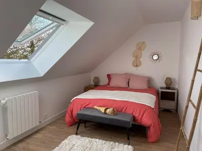 Un ou plusieurs lits dans un hébergement de l'établissement Appartement cosy sous les toits