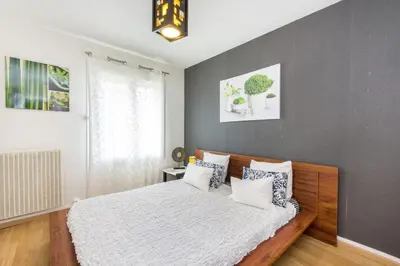 Un ou plusieurs lits dans un hébergement de l'établissement Appartement charmant au cœur de Caen - 70 m² - Parking inclus