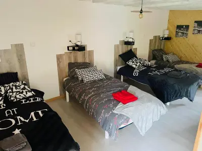 Un ou plusieurs lits dans un hébergement de l'établissement Grange à grains à l'Ombre d'une Tour