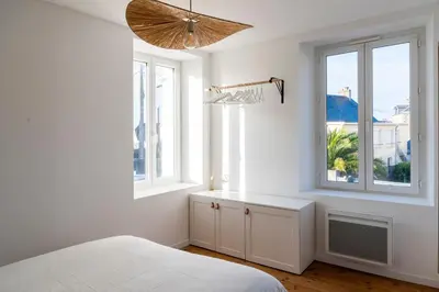 Un ou plusieurs lits dans un hébergement de l'établissement Jolie maison proche centre-ville et plages