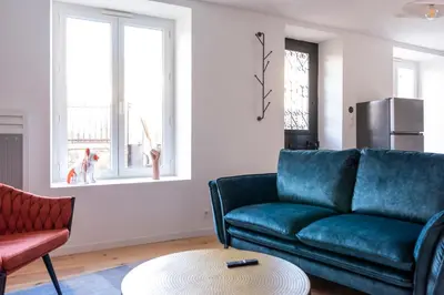 Coin salon dans l'établissement Jolie maison proche centre-ville et plages