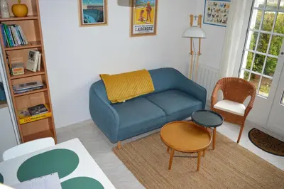 Coin salon dans l'établissement Triplex avec jardinet - wifi - à 400m de la plage