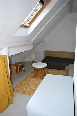 Un ou plusieurs lits dans un hébergement de l'établissement Triplex avec jardinet - wifi - à 400m de la plage