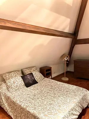 Un ou plusieurs lits dans un hébergement de l'établissement Maison traditionnelle Normande avec piscine