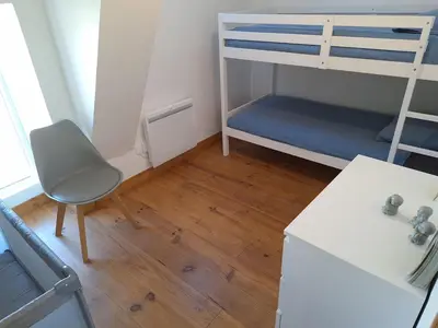 Un ou plusieurs lits dans un hébergement de l'établissement Au Lutin Pommé - Maison de vacances Bretagne