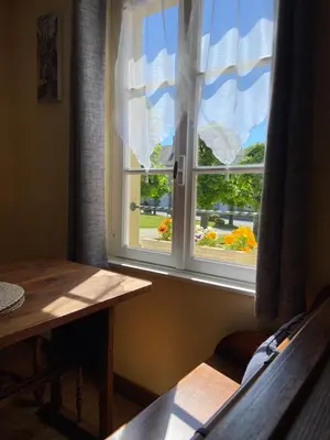 Coin salon dans l'établissement The Bell`s End Cottage