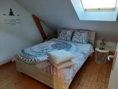 Un ou plusieurs lits dans un hébergement de l'établissement Cottage Le Héron, à 5 minutes du Mont St-Michel