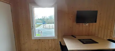 Télévision ou salle de divertissement dans l'établissement gîte du haras