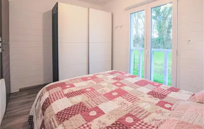 Un ou plusieurs lits dans un hébergement de l'établissement Amazing Home In Hermanville-Sur-Mer