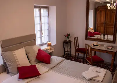 Un ou plusieurs lits dans un hébergement de l'établissement Une Suite au jardin