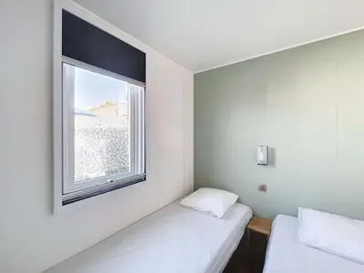 Un ou plusieurs lits dans un hébergement de l'établissement Mobil-Home Grand Confort 6 Pers, 3 Chambres, Terrasse, Plage à 200m, Piscine Chauffée - FR-1-361A-22