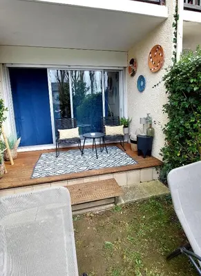 Coin salon dans l'établissement Cosy studio le Garden ensoleillé
