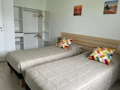 Un ou plusieurs lits dans un hébergement de l'établissement Gîte de vacances
