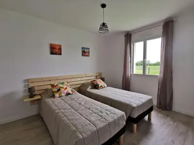 Un ou plusieurs lits dans un hébergement de l'établissement Gîte de vacances