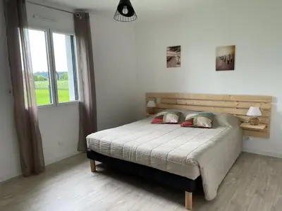 Un ou plusieurs lits dans un hébergement de l'établissement Maison de vacances