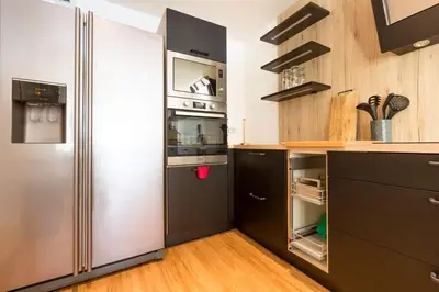 Cuisine ou kitchenette dans l'établissement Les Pieds Dans L'Eau - Bel appartement - Vue mer