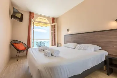 Un ou plusieurs lits dans un hébergement de l'établissement Les Pieds Dans L'Eau - Bel appartement - Vue mer