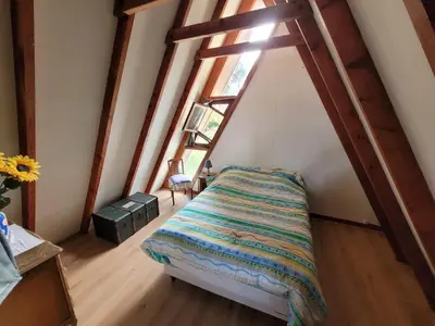 Un ou plusieurs lits dans un hébergement de l'établissement Chalet de vacances au bord de mer VER SUR MER