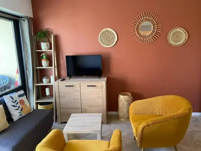 Télévision ou salle de divertissement dans l'établissement Escapade Courseullaise