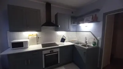 Cuisine ou kitchenette dans l'établissement A La Maison - hébergement de luxe