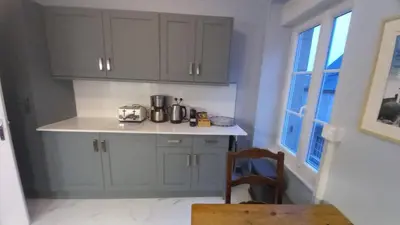 Cuisine ou kitchenette dans l'établissement A La Maison - hébergement de luxe