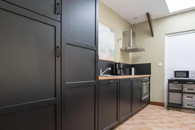 Cuisine ou kitchenette dans l'établissement Gîte Rogonde