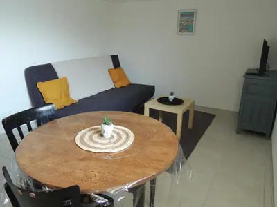 Coin salon dans l'établissement Appartement entre terre et baie