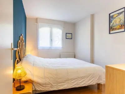 Un ou plusieurs lits dans un hébergement de l'établissement Apartment Montaigu by Interhome