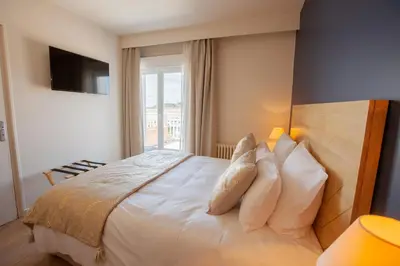 Un ou plusieurs lits dans un hébergement de l'établissement Hôtel des Isles