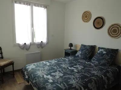 Un ou plusieurs lits dans un hébergement de l'établissement Gîte entre terre et baie