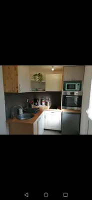 Cuisine ou kitchenette dans l'établissement Petite maison