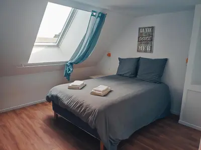 Un ou plusieurs lits dans un hébergement de l'établissement Barneville Plage appart cosy avec terrasse 150m de la mer