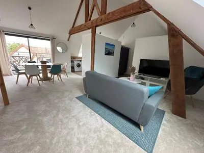 Télévision ou salle de divertissement dans l'établissement Barneville Plage appart cosy avec terrasse 150m de la mer