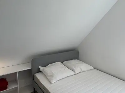 Un ou plusieurs lits dans un hébergement de l'établissement Appartement 2 pièces en bord de mer avec accès direct à la plage de Cabourg, proche Thalassothérapie - FR-1-487-336