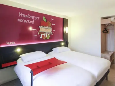 Un ou plusieurs lits dans un hébergement de l'établissement ibis Styles Flers